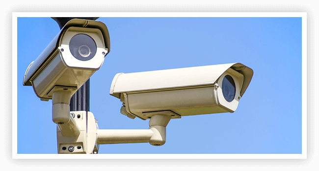 CCI Risk Analysis LLC Two cameras are mounted on a pole to look like they 're looking at something.