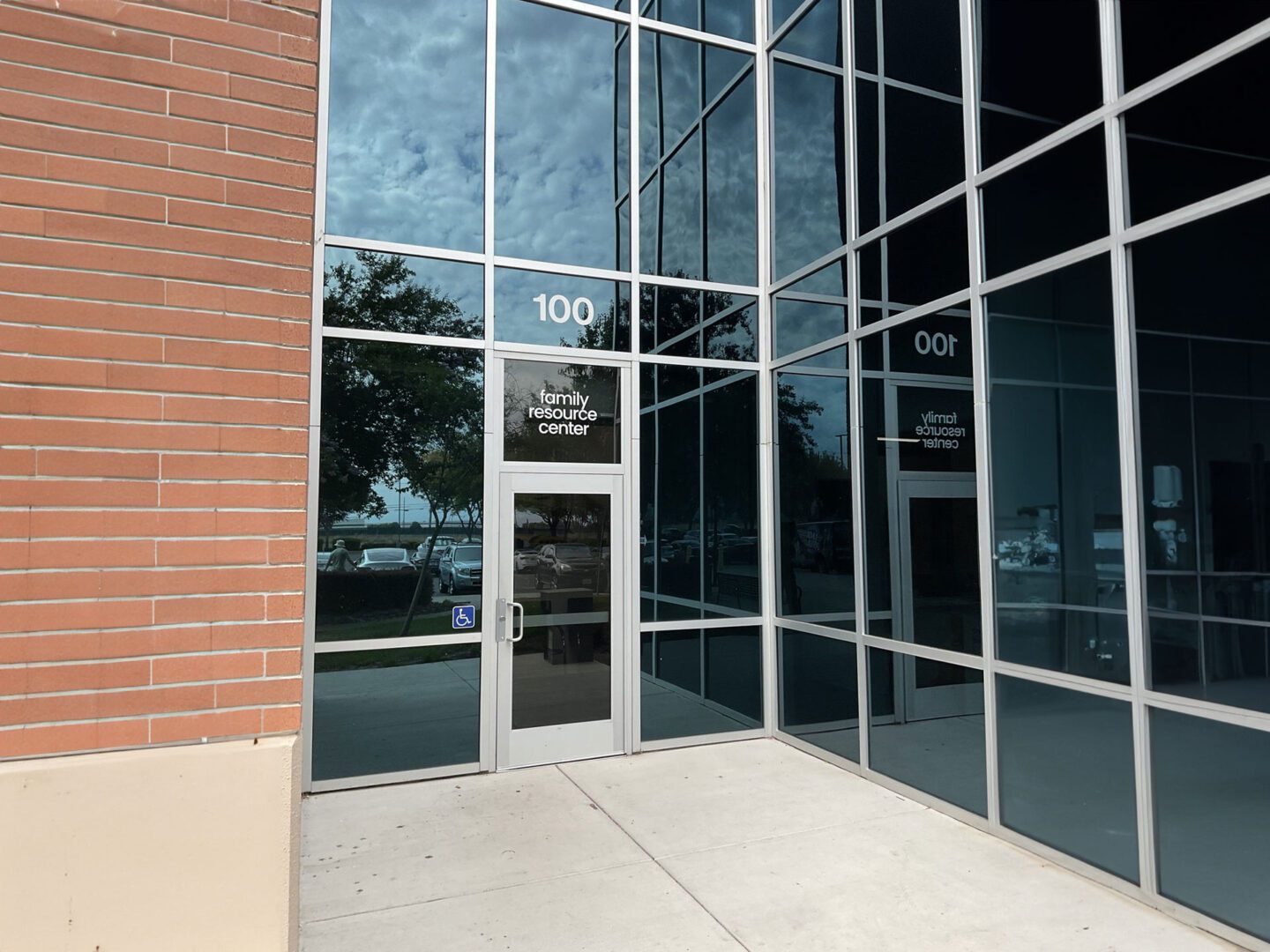 A front gate of a building with the words family resource center